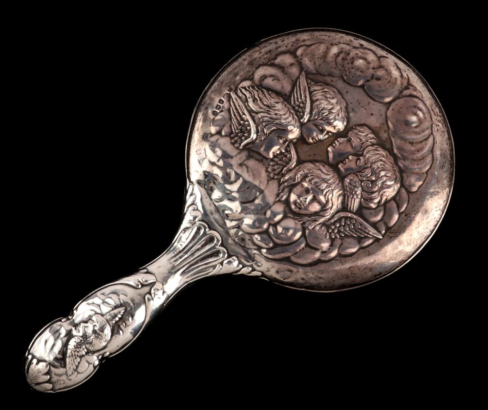 A 1919 STERLING HAND MIRROR WITH REYNOLDS ANGELS