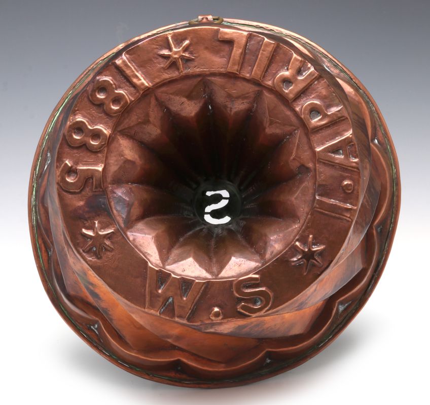 AN ANTIQUE COPPER FOOD MOLD EMBOSSED DATE 1885