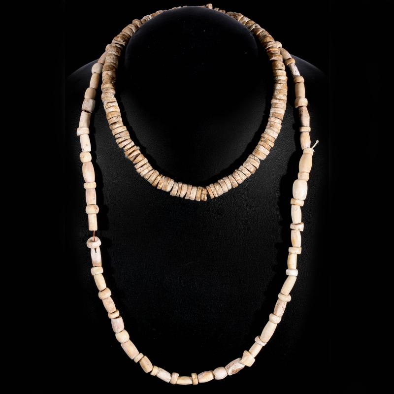 STRANDS OF CARVED BONE BEADS AND SHELL DISCS