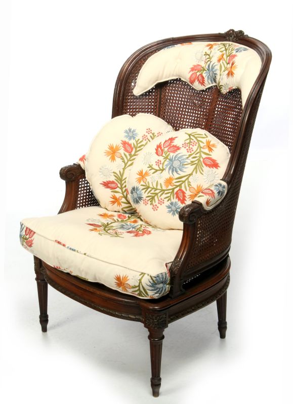 A LOUIS XVI STYLE CANE BACK BERGERE WITH STOOL