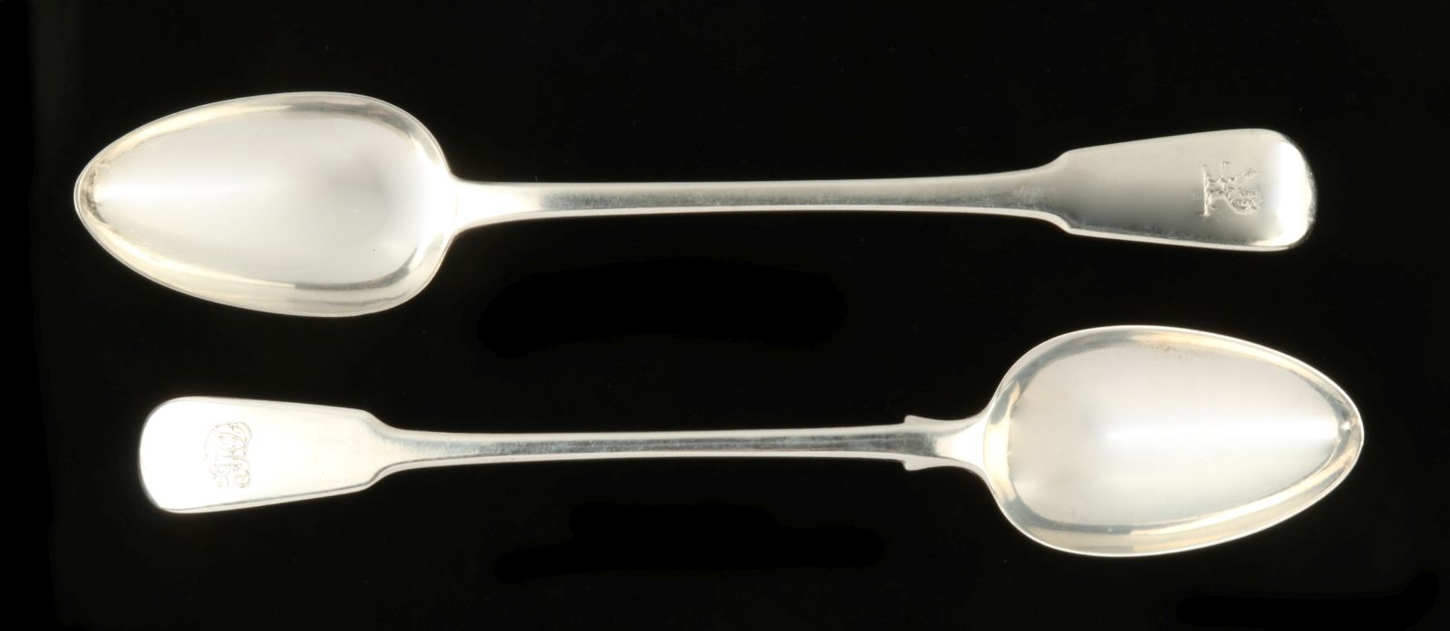 A PAIR 1820 BRITISH STERLING STUFFING SPOONS