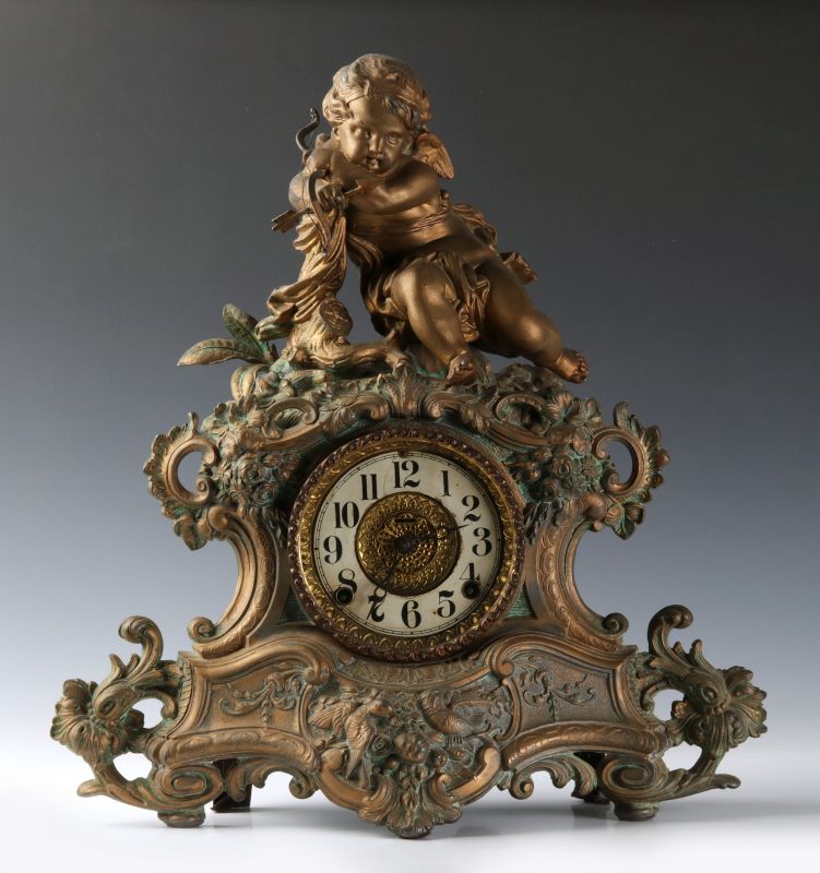 A NICHOLAS MULLER SPELTER CLOCK WITH FIGURAL CUPID