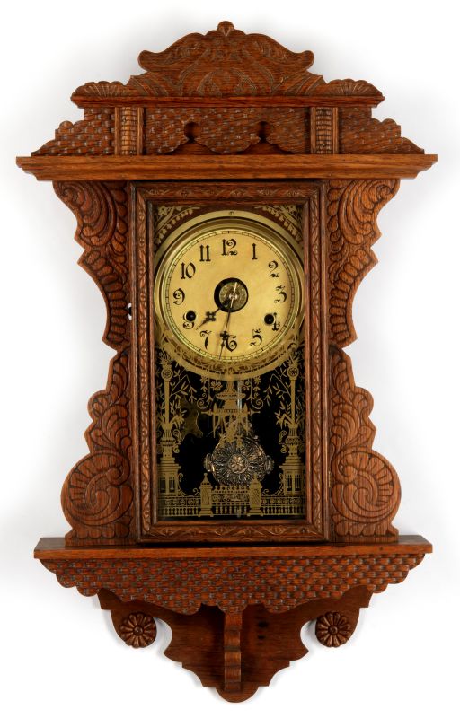 A HANGING GINGERBREAD KITCHEN WALL CLOCK