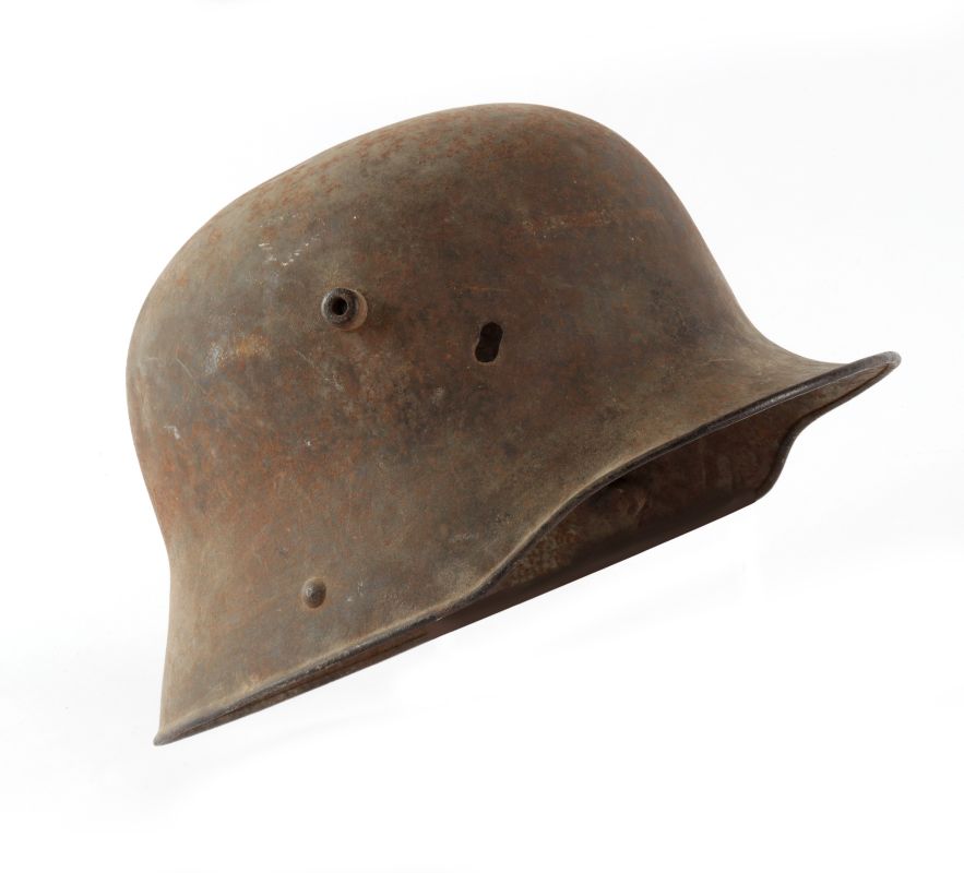A WWI GERMAN M-16 HELMET WITH BULLET PASS THROUGH