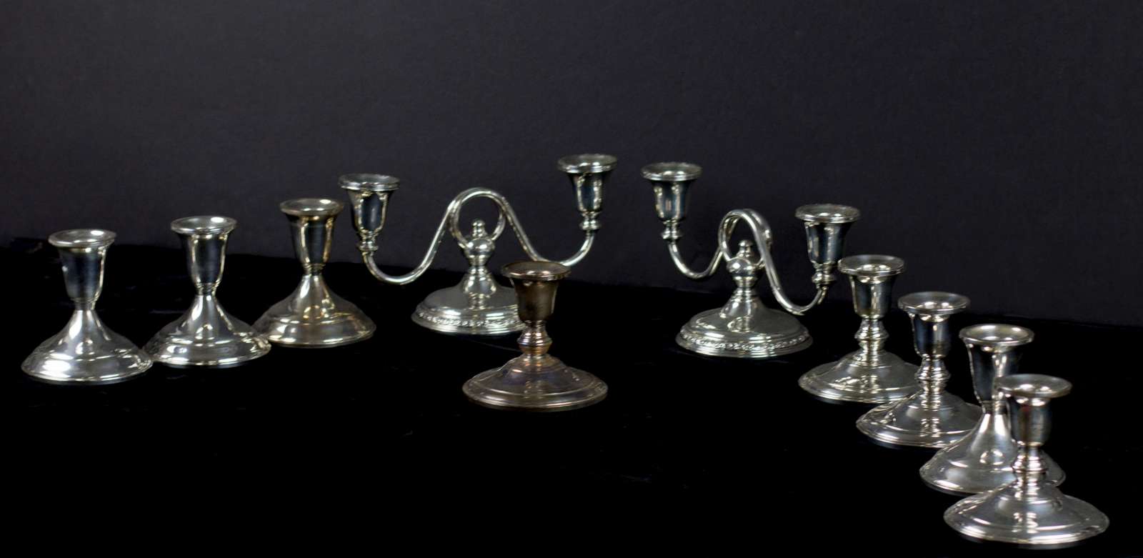 A COLLECTION OF 20TH C. STERLING SILVER CANDLE HOLDERS