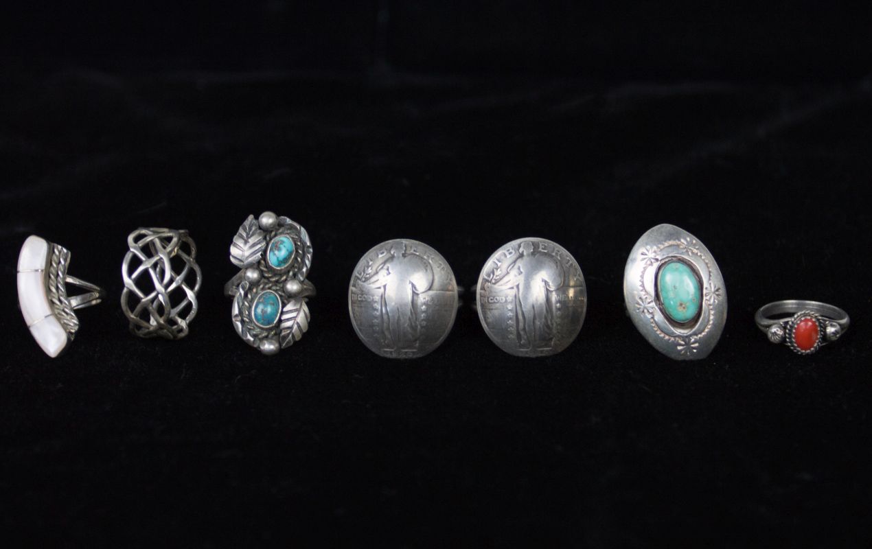 SEVEN STERLING AND COIN SILVER RINGS