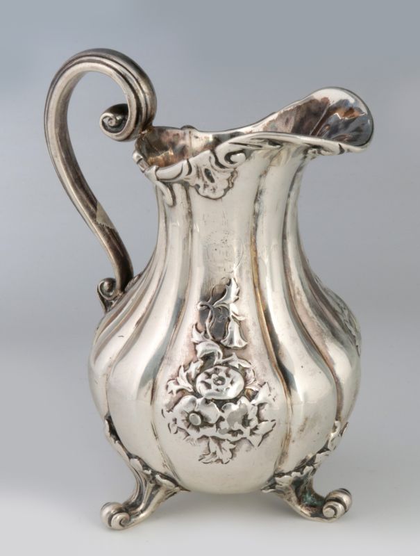 A LONDON 1840 STERLING SILVER FOOTED PITCHER