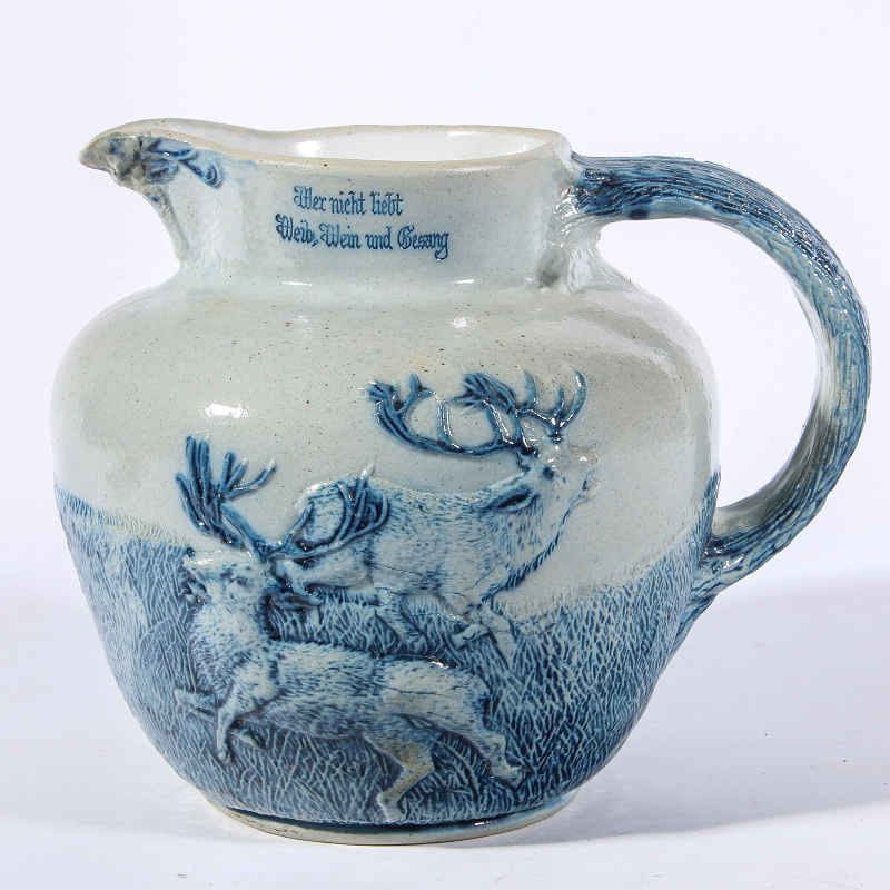 A GOOD BLUE AND GRAY STONEWARE JUG WITH ELK