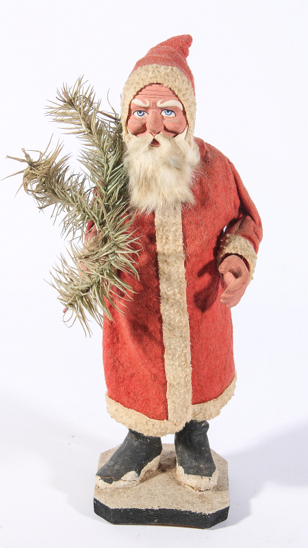 A GERMAN FATHER CHRISTMAS FIGURE WITH FEATHER TREE