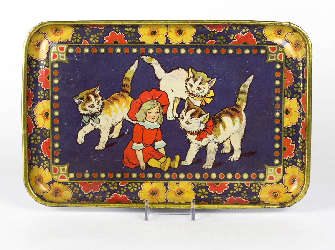 A GERMAN TIN LITHO TRAY WITH A DOLL AND KITTENS