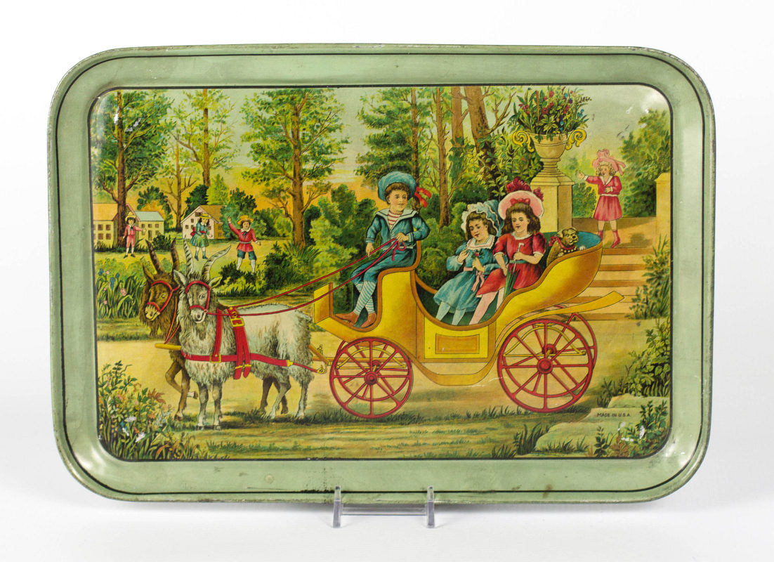 A TIN LITHO TRAY WITH A CARRIAGE PULLED BY GOATS
