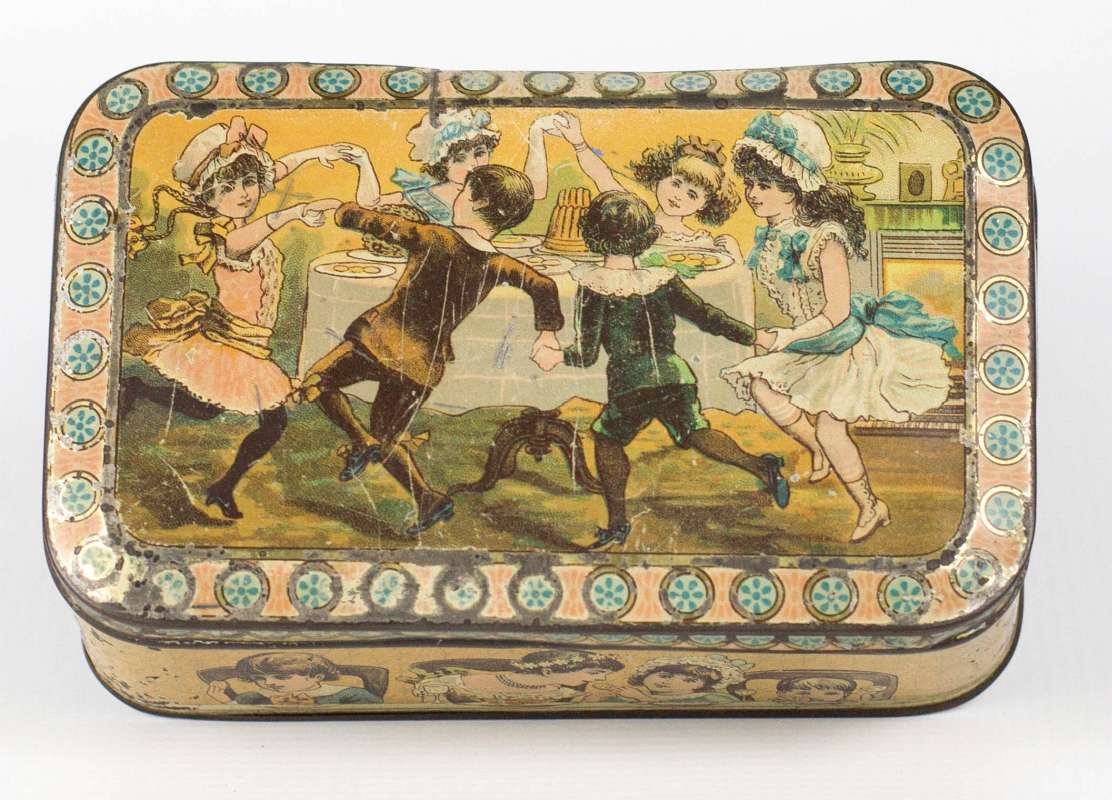 AN ANTIQUE ENGLISH BISCUIT TIN