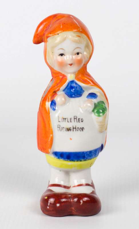A VINTAGE LITTLE RED RIDING HOOD TOOTHBRUSH HOLDER