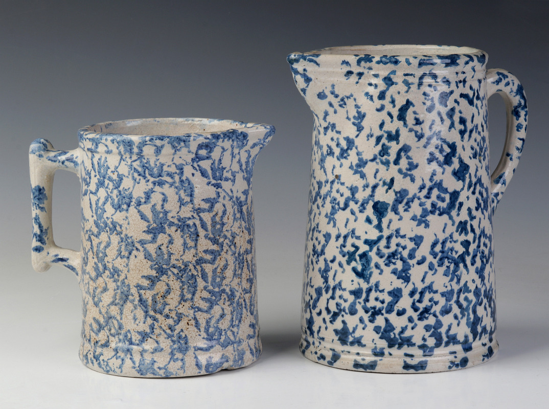 TWO BLUE AND WHITE SPONGED STONEWARE PITCHERS