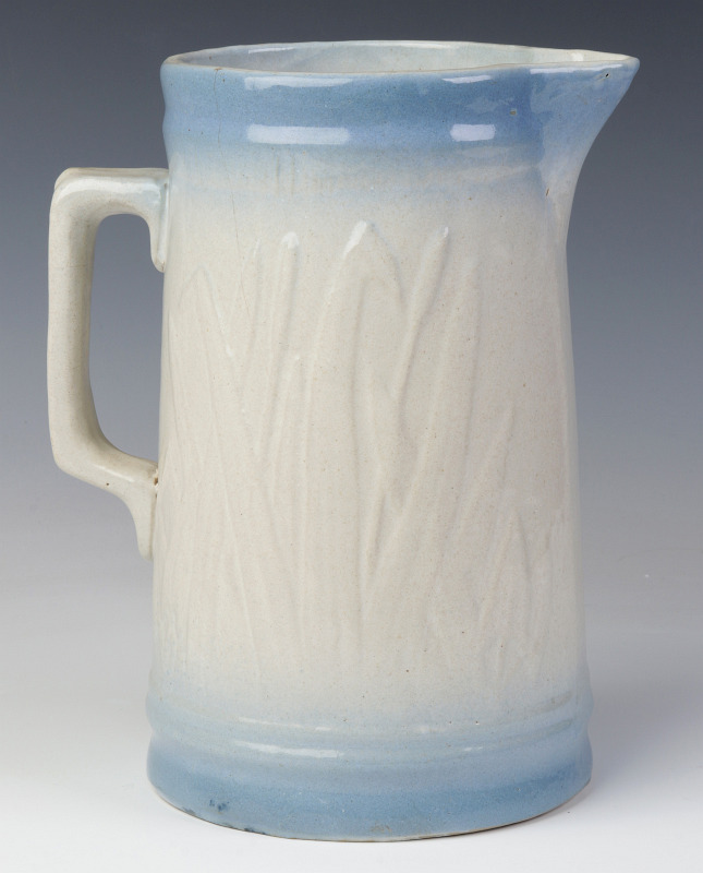 A CATTAIL PATTERN BLUE AND WHITE STONEWARE PITCHER
