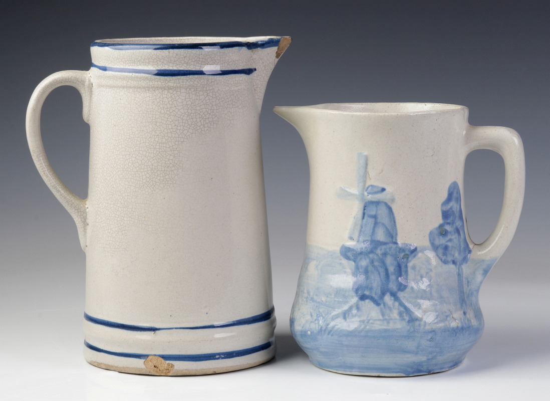 TWO BLUE AND WHITE STONEWARE PITCHERS