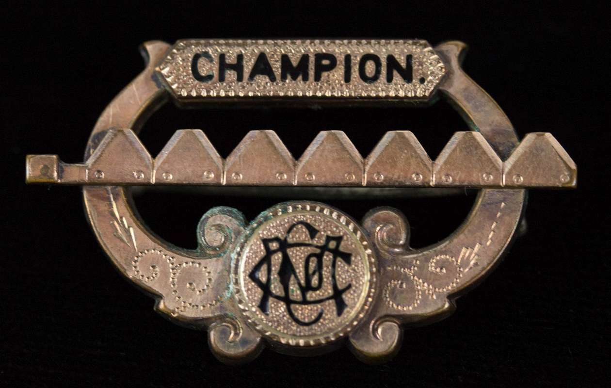 CCMO 'CHAMPION' GOLD FILLED PIN WITH BLACK ENAMEL