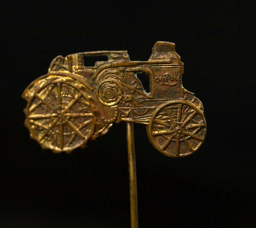AN ADVANCE-RUMELY FIGURAL ADVERTISING STICKPIN