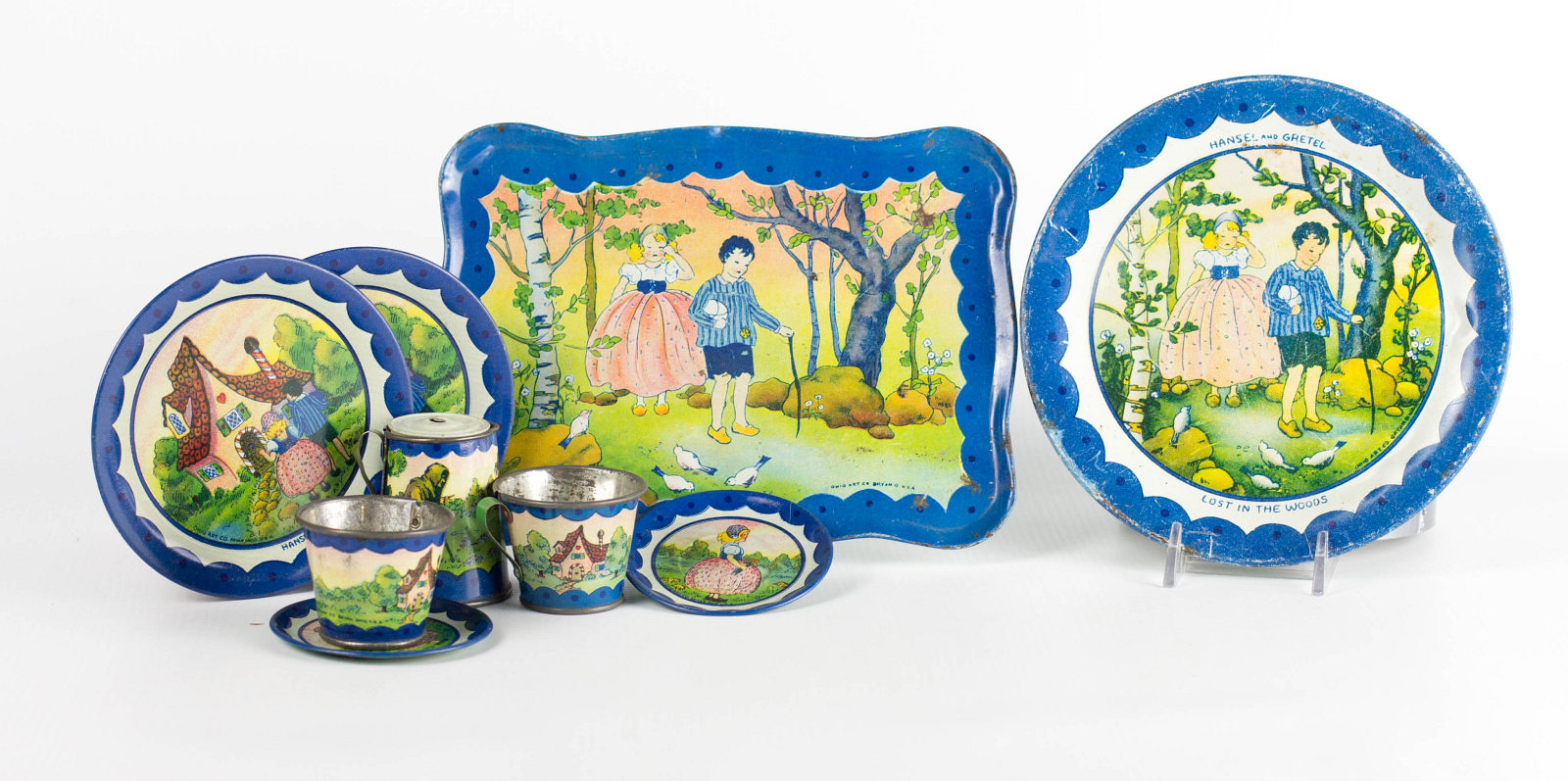 A TIN LITHO CHILD'S TEA SET WITH HANSEL AND GRETEL