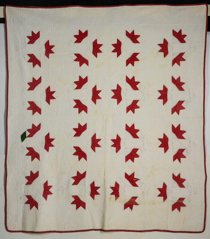 AN UNUSUAL ANTIQUE RED AND WHITE QUILT