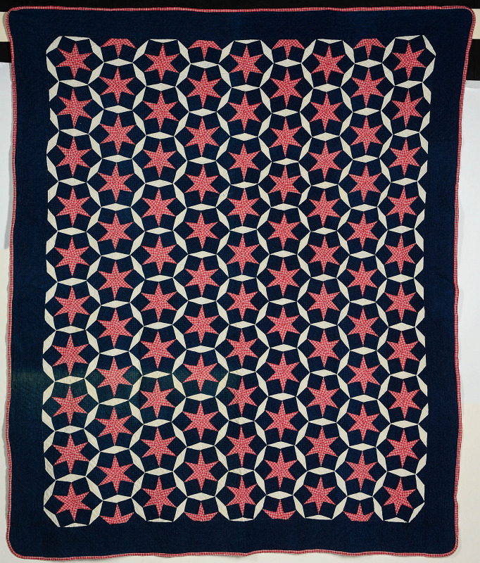 A RED, WHITE AND BLUE STARS QUILT