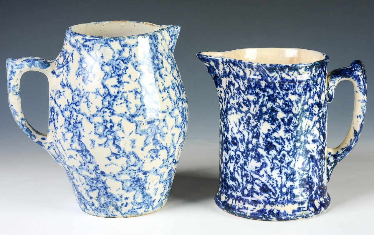 TWO BLUE AND WHITE SPONGE WARE PITCHERS