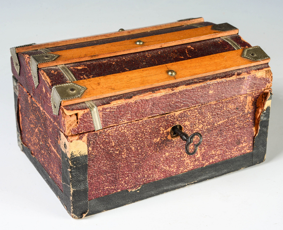 A 19TH CENTURY DOLL SIZE VICTORIAN TRAVEL TRUNK