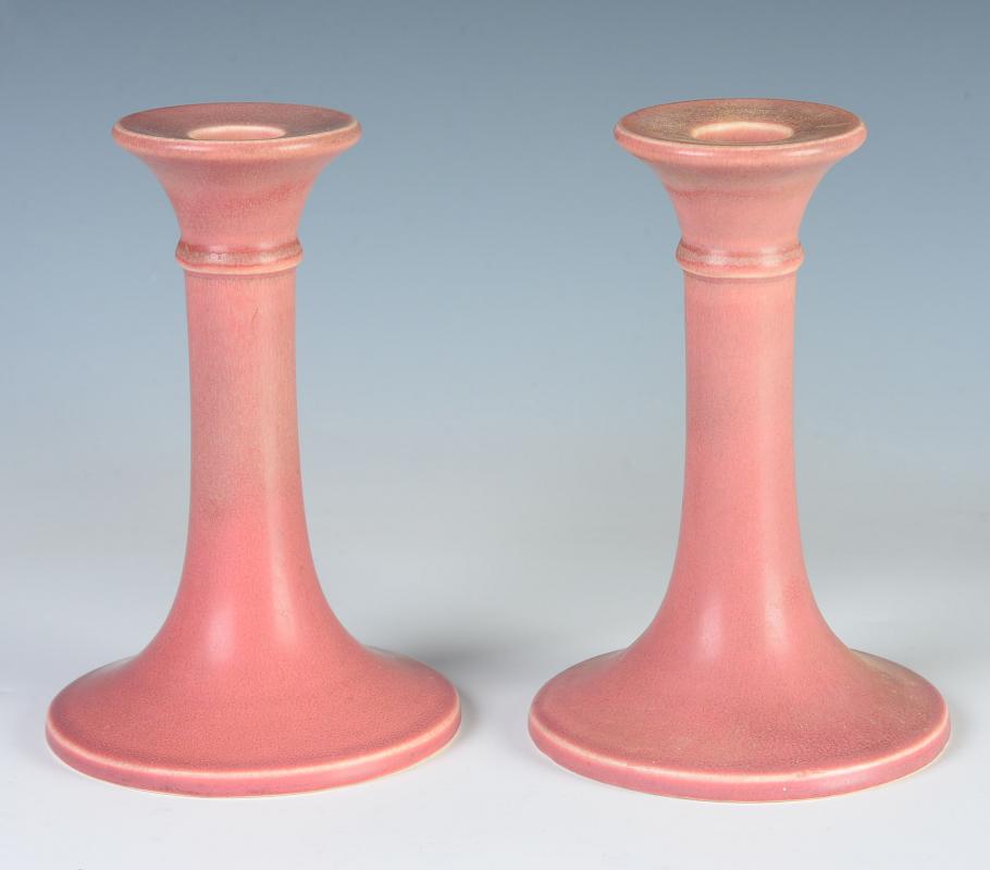 A PAIR OF ROOKWOOD CANDLE STICKS DATED 1921