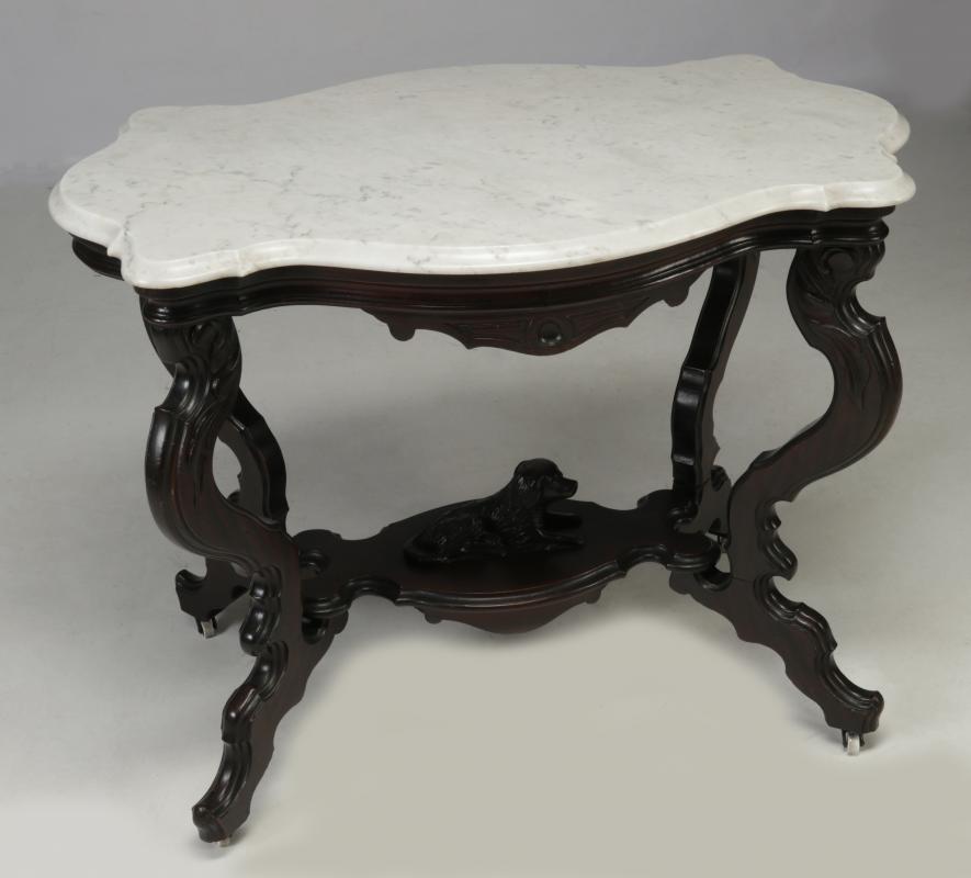 A VICTORIAN TURTLE TOP PARLOR TABLE WITH DOG