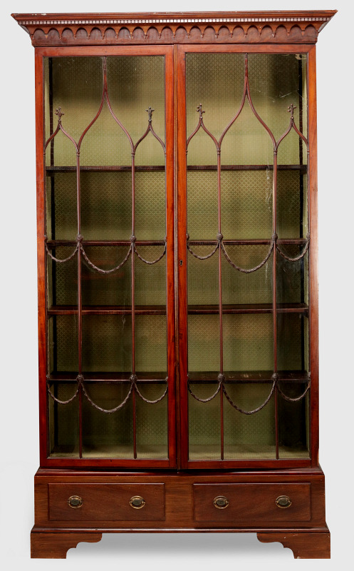 A 19TH CENTURY GOTHIC STYLE TWO DOOR BOOKCASE