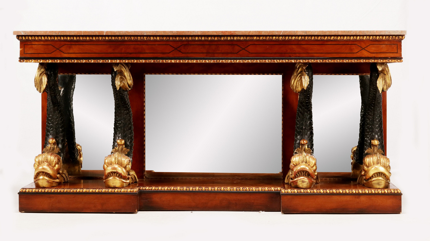 A REGENCY STYLE MIRRORED CONSOLE WITH DOLPHINS