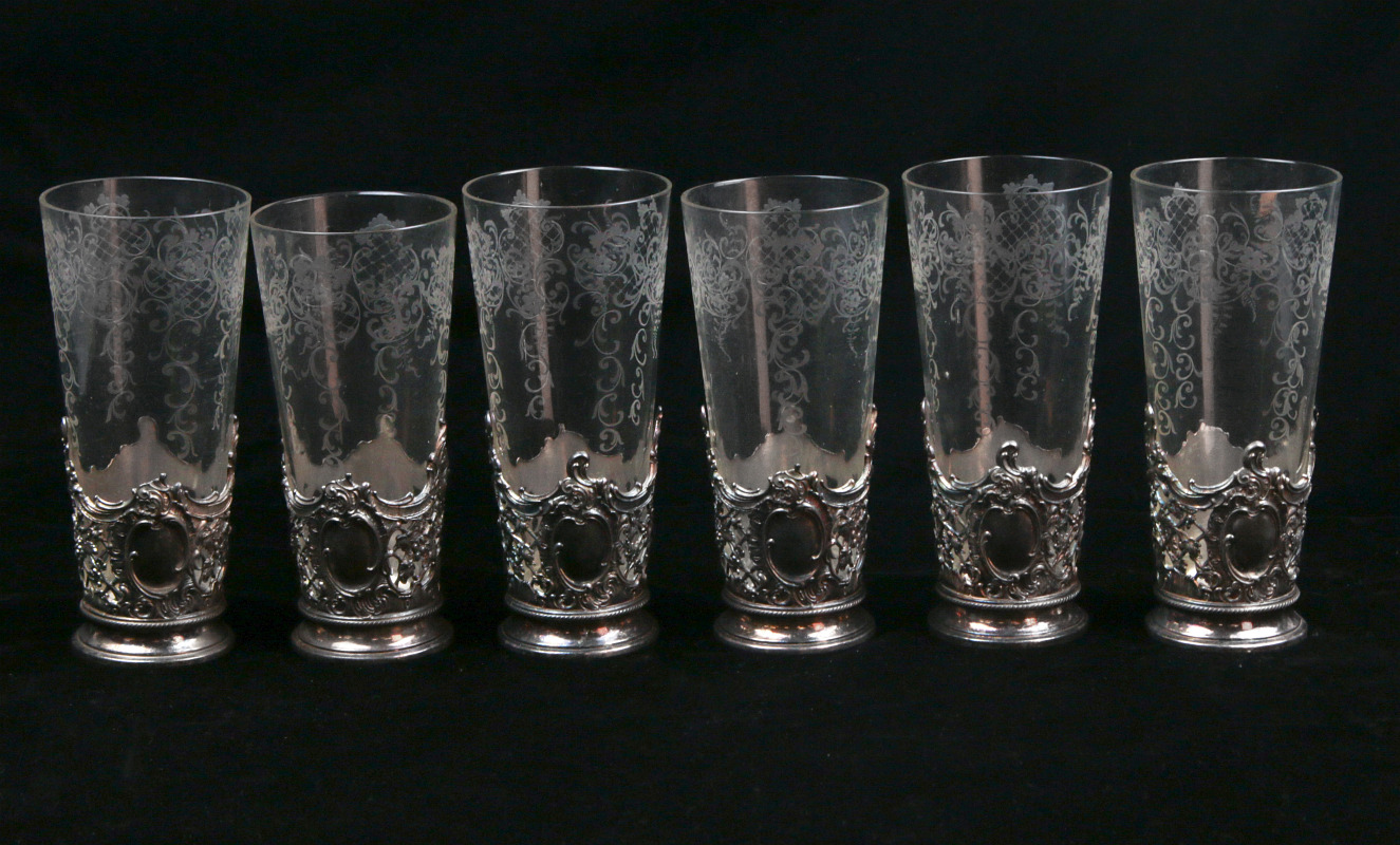 SIX FRENCH ETCHED GLASS BEAKERS IN SILVER PLATE 