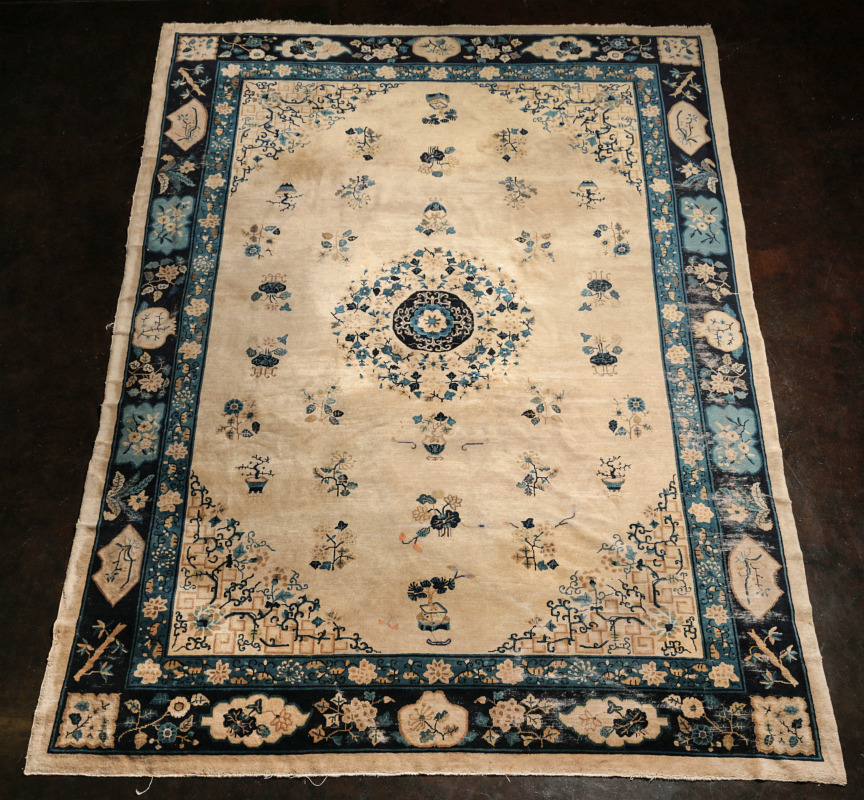 AN ANTIQUE CHINESE ROOM SIZE CARPET