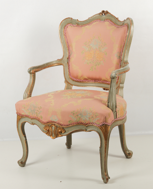A FRENCH STYLE FAUTEUIL PAINTED GREEN AND GOLD