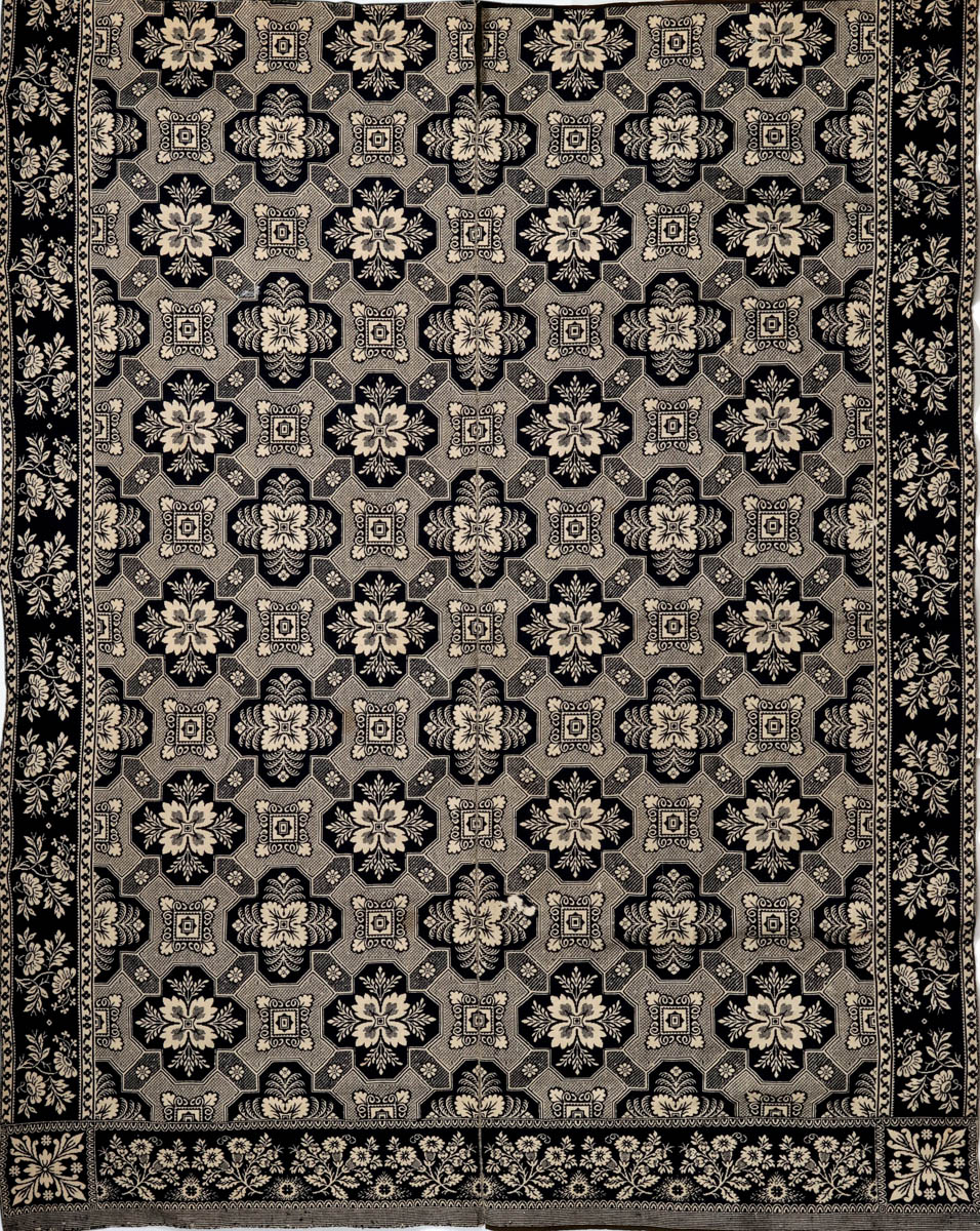 A 19TH CENTURY JACQUARD WOVEN COVERLET