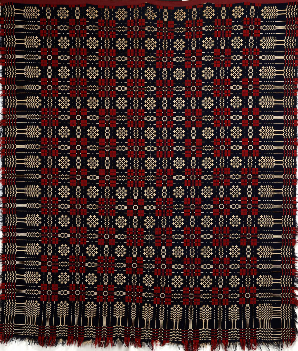 A 19TC. RED, WHITE AND BLUE SUMMER WINTER COVERLET