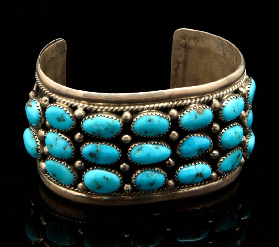 A LARGE GENT'S NAVAJO CUFF W 22 TURQUOISE STONES