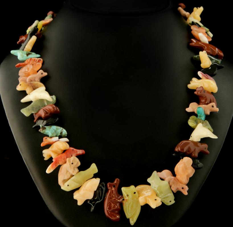 A LATE 20TH CENTURY CARVED STONE FETISH NECKLACE