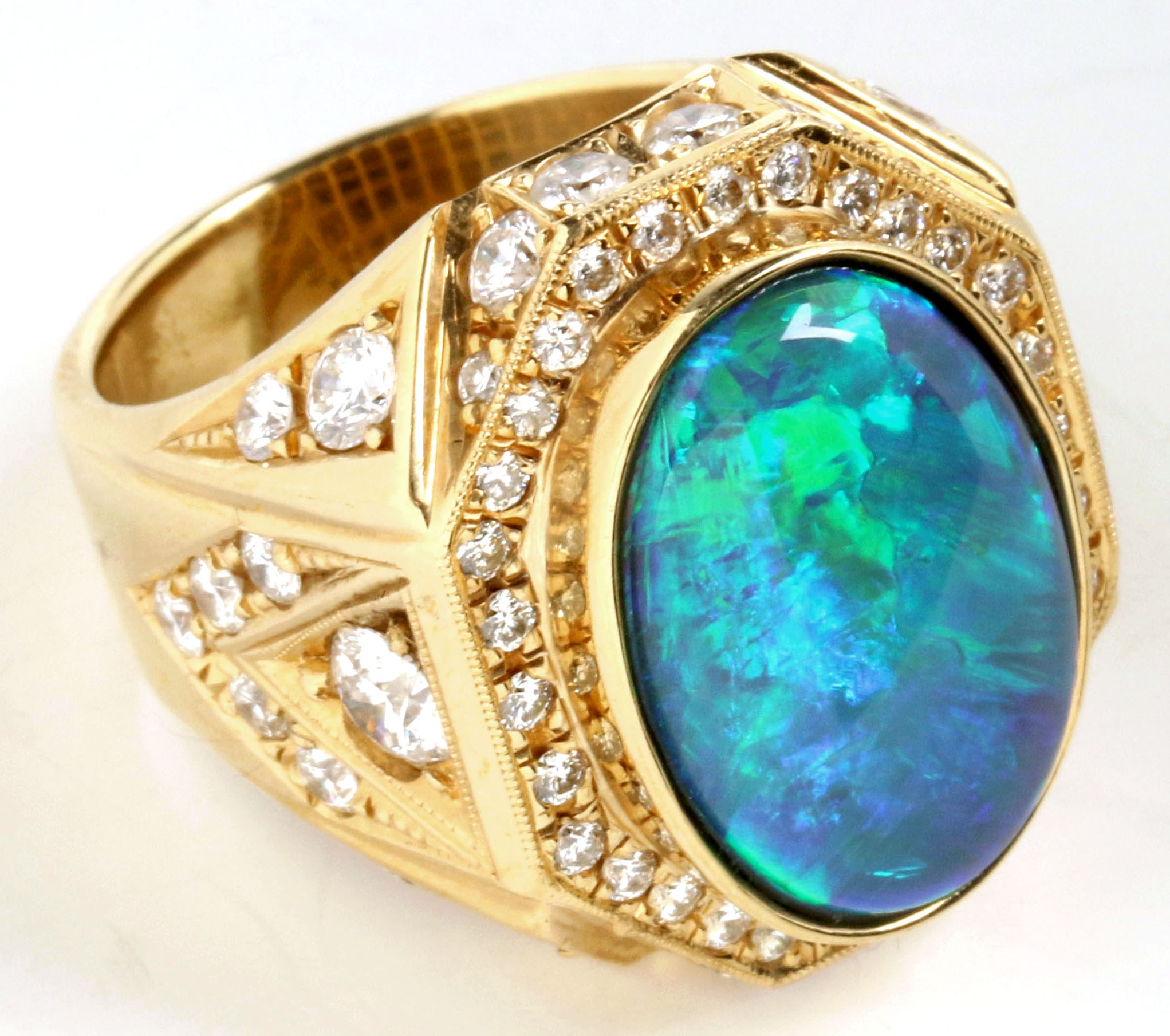 A GENT'S 18K GOLD BOULDER OPAL RING WITH DIAMONDS