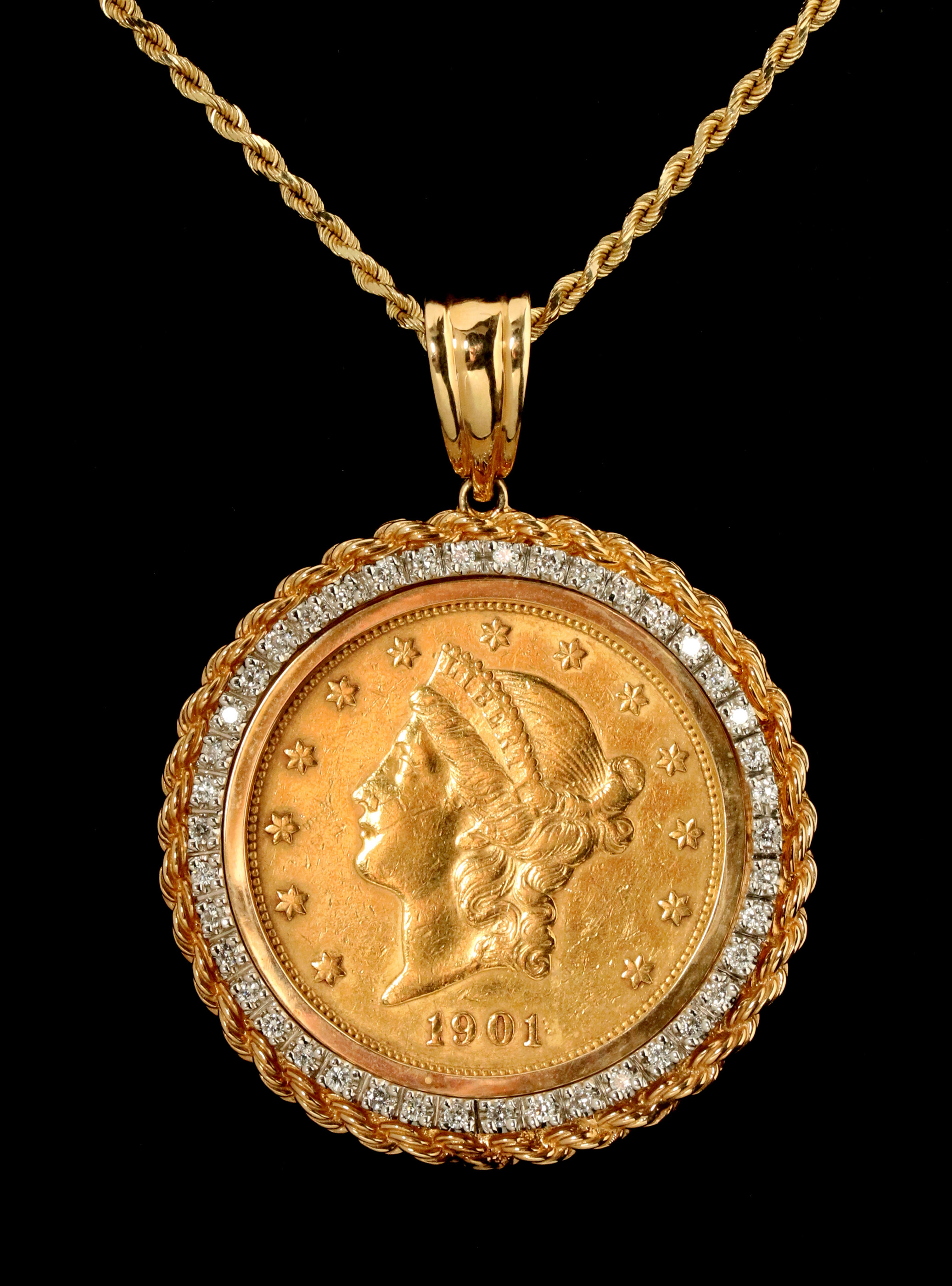 A $20 LIBERTY U.S. GOLD COIN IN DIAMOND SET BEZEL