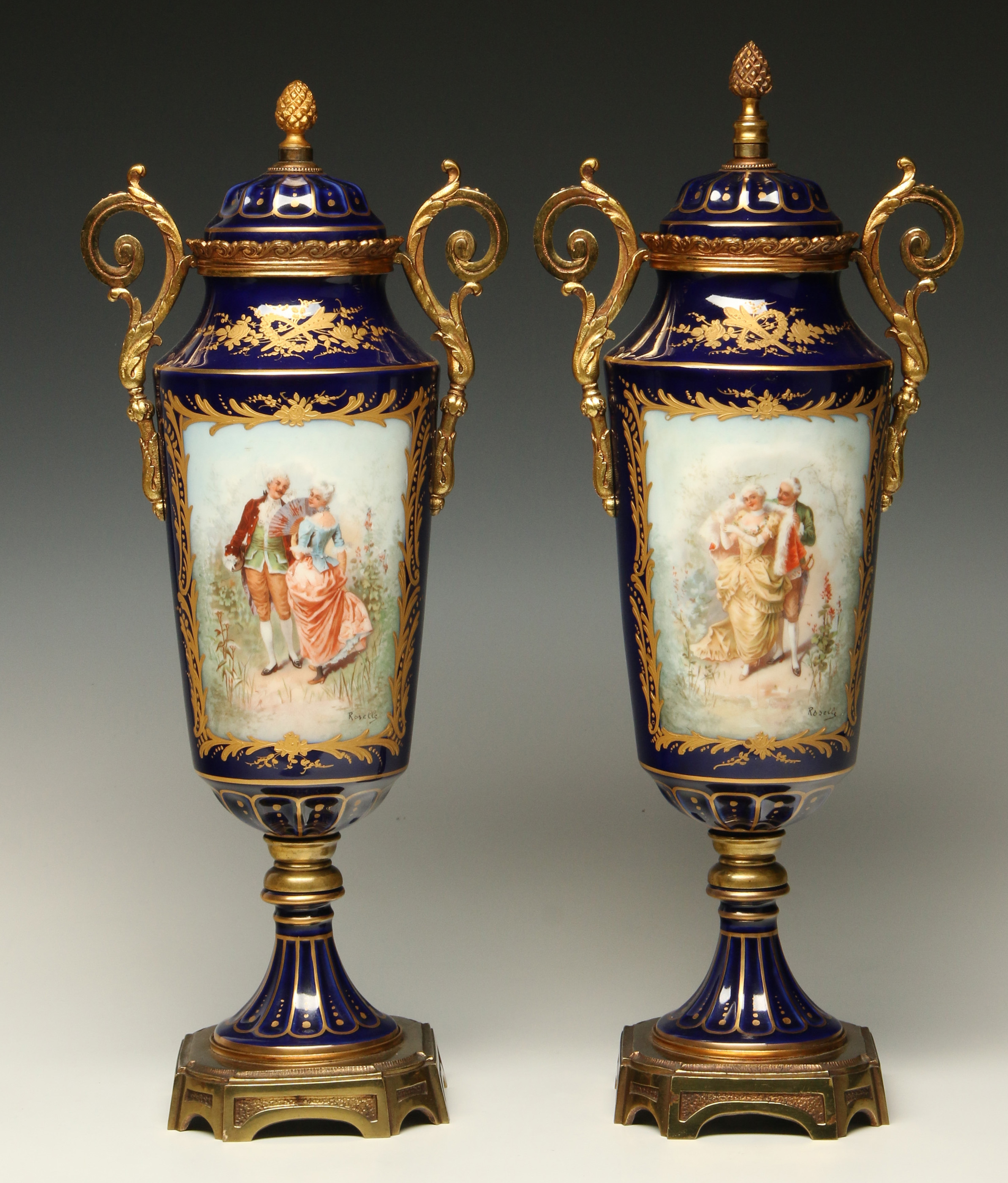 A PAIR OF CIRCA 1900 SEVRES STYLE PORCELAIN URNS