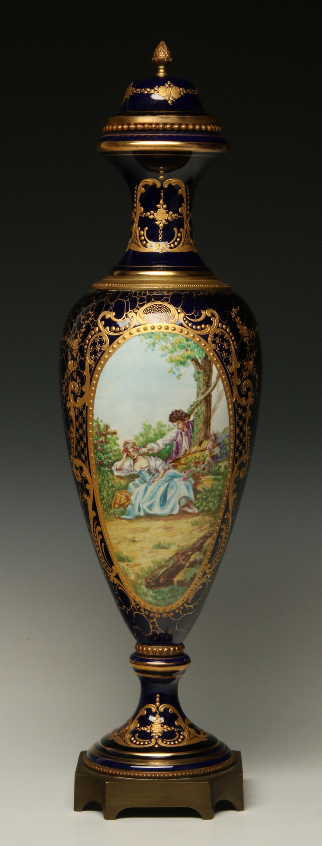 A 20TH CENTURY SEVRES STYLE URN WITH BRONZE MOUNTS