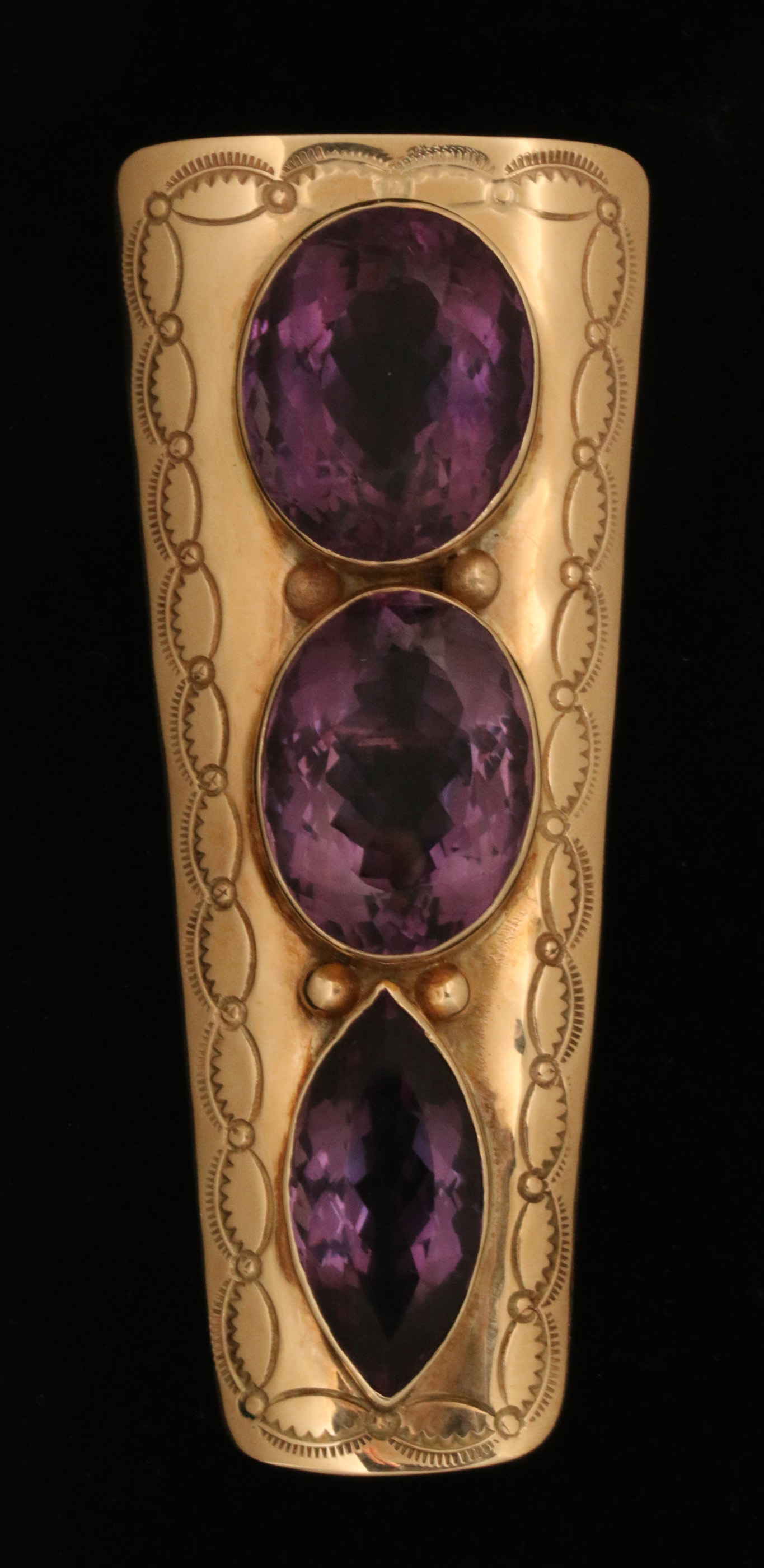 A LARGE 14K GOLD ENHANCER WITH BRAZILIAN AMETHYST