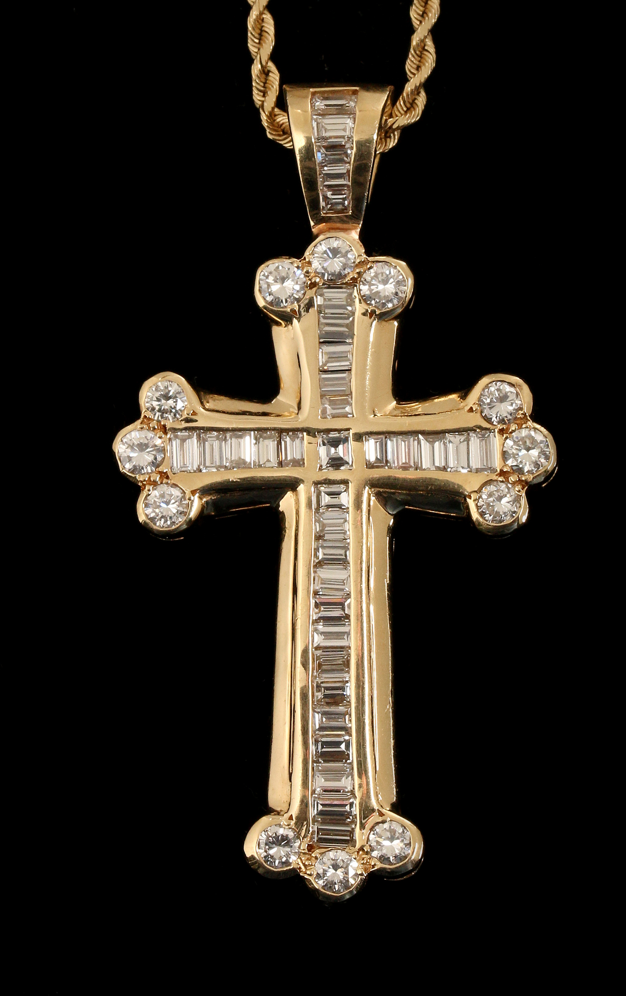 A 14K CROSS PENDANT WITH APPROX. 4 CARATS TW DIAMO