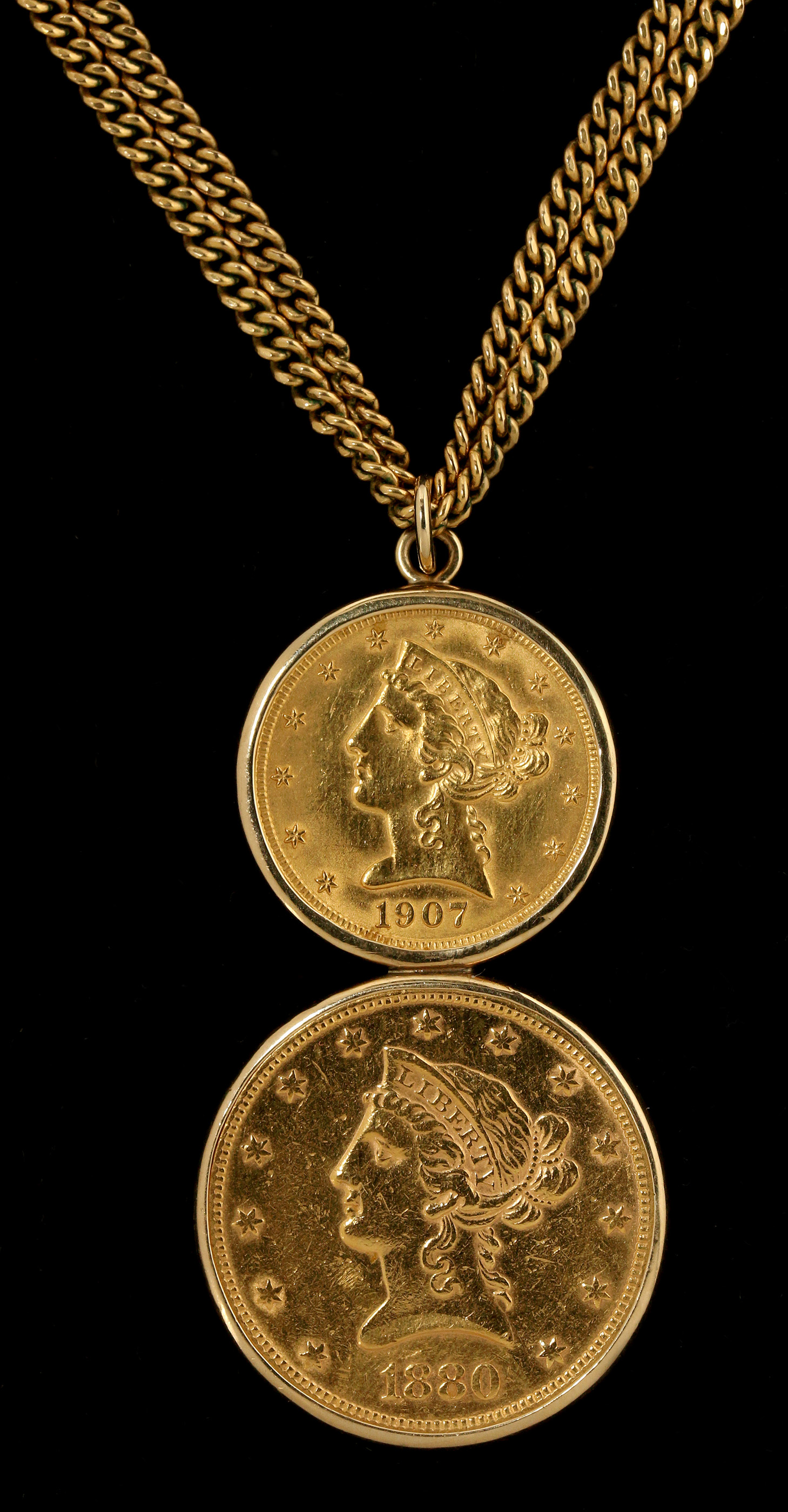 A GOLD PENDANT WITH FIVE AND TEN DOLLAR US GOLD CO