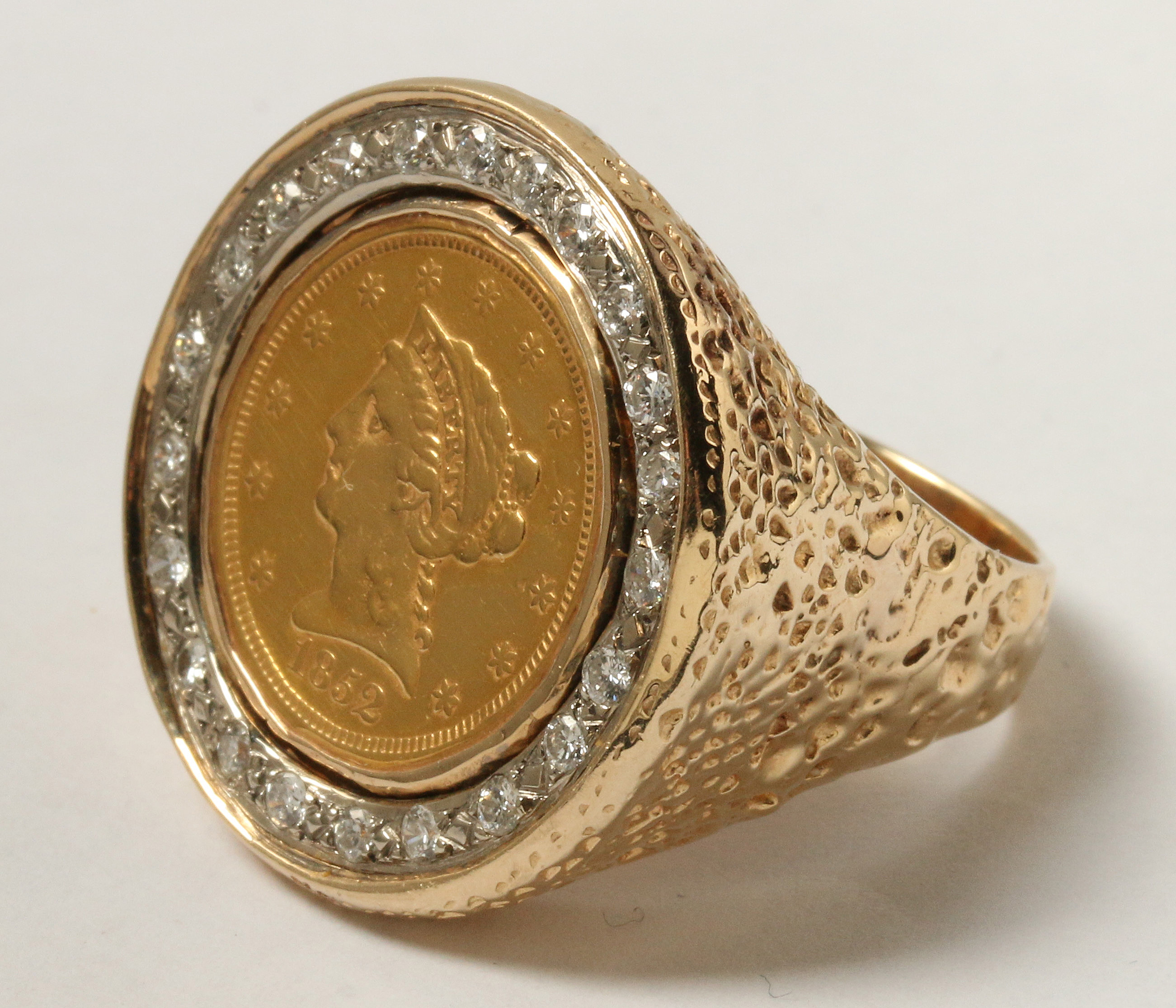 A GENT'S 14K GOLD RING WITH US COIN AND DIAMONDS