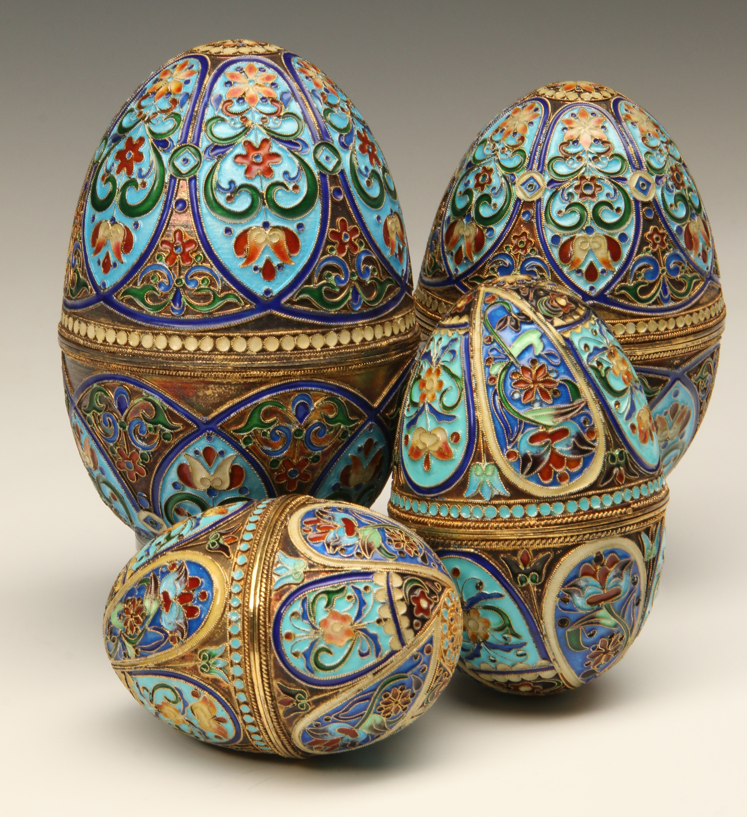 FOUR 20TH CENTURY ENAMELED STERLING CHAMPLEVE EGGS