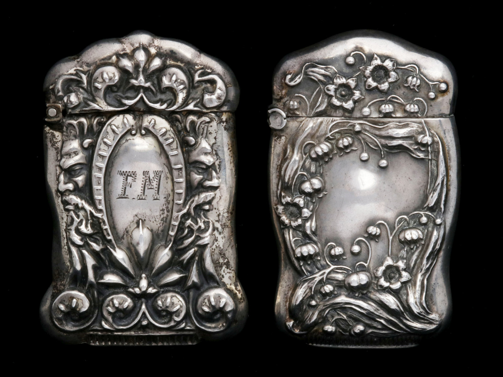 TWO ANTIQUE STERLING SILVER MATCH SAFES