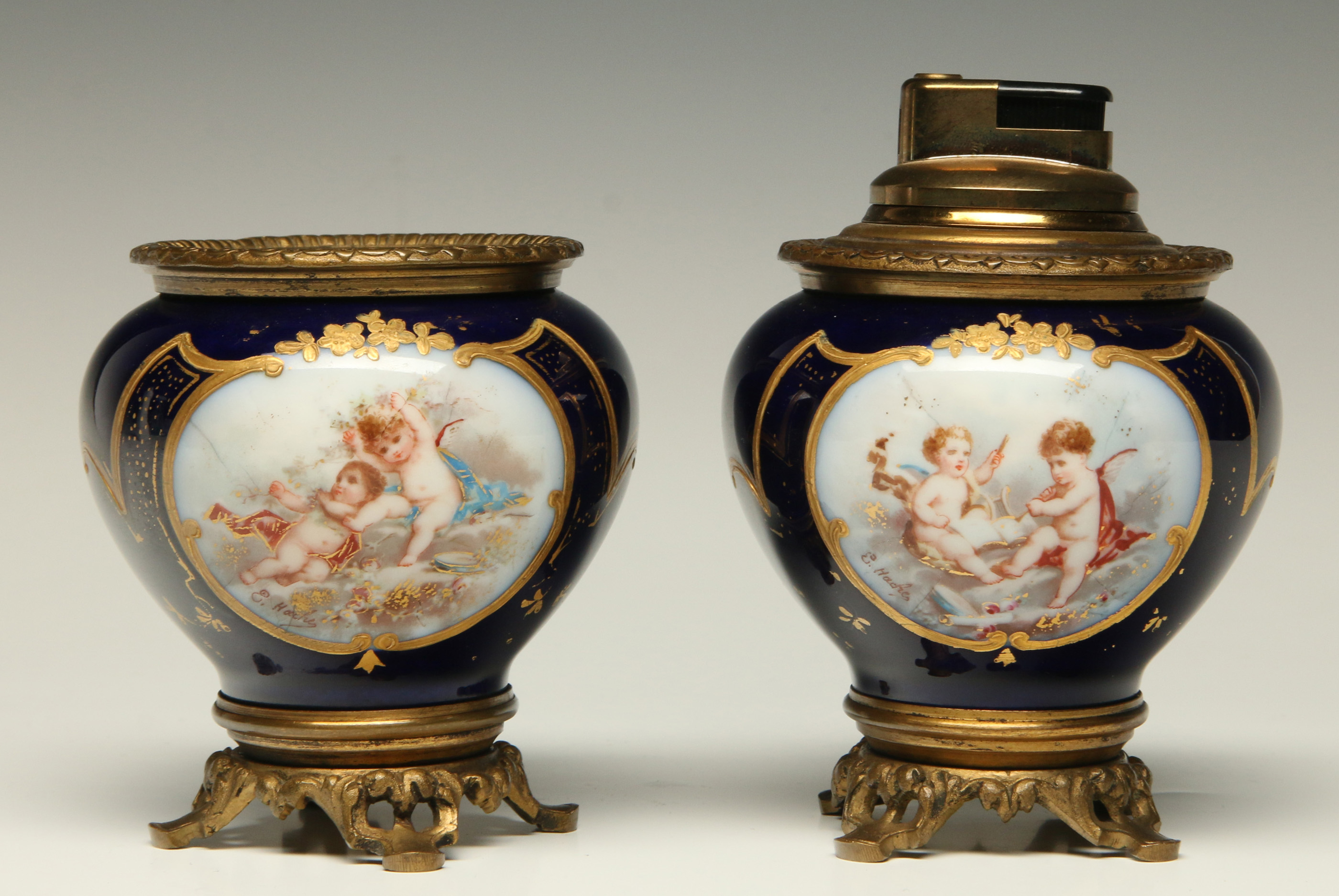 A PAIR OF SEVRES STYLE PORCELAIN TABLE ARTICLES