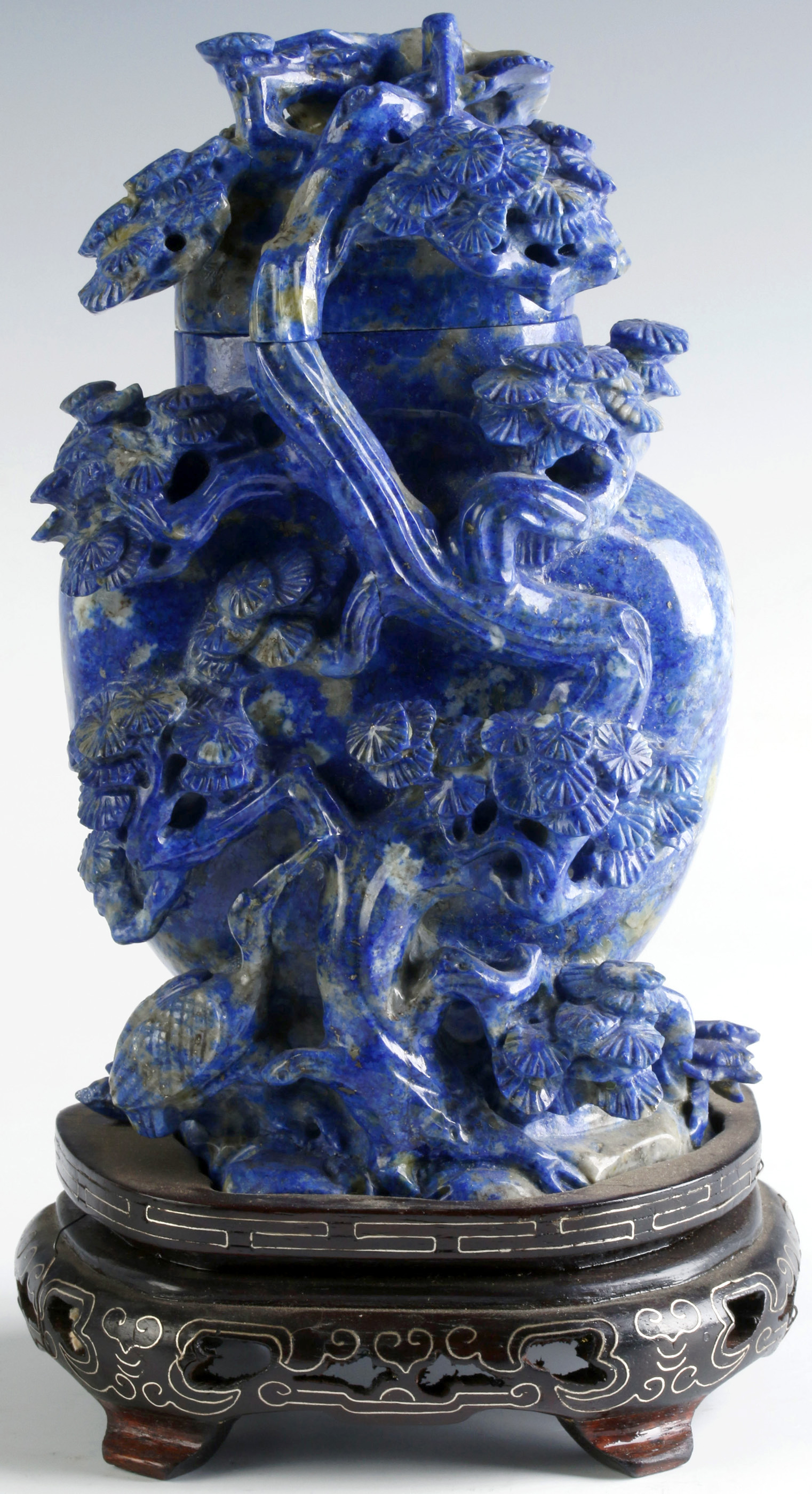 A CHINESE CARVED LAPIS COVERED VASE ON STAND
